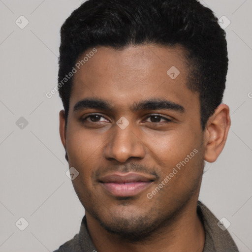 Joyful black young-adult male with short  black hair and brown eyes