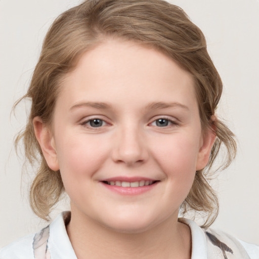 Joyful white child female with medium  brown hair and grey eyes