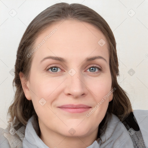 Joyful white young-adult female with medium  brown hair and blue eyes