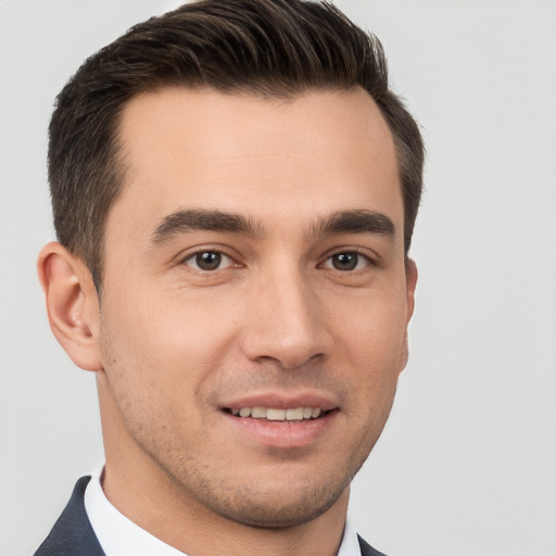 Joyful white young-adult male with short  brown hair and brown eyes