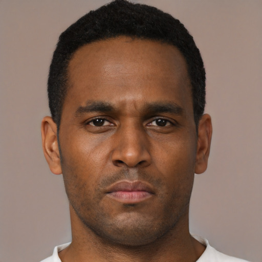 Neutral black young-adult male with short  brown hair and brown eyes