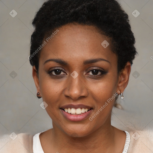 Joyful black young-adult female with short  black hair and brown eyes