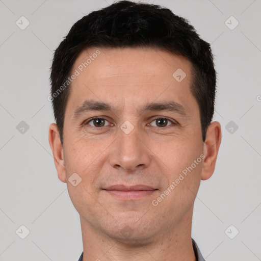 Joyful white young-adult male with short  black hair and brown eyes