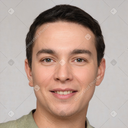 Joyful white young-adult male with short  black hair and brown eyes