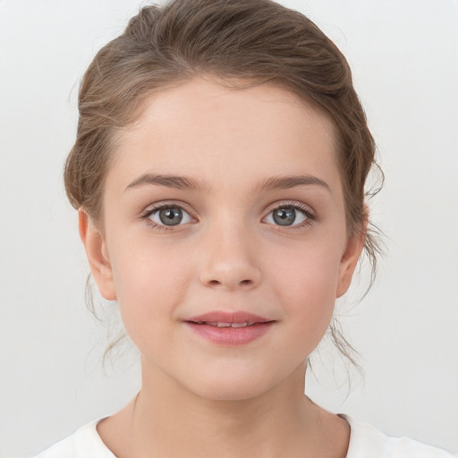 Joyful white child female with medium  brown hair and grey eyes