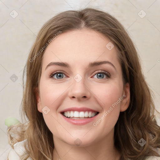 Joyful white young-adult female with medium  brown hair and green eyes