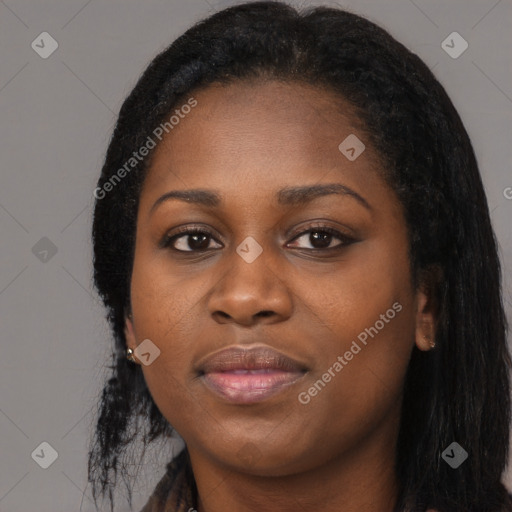 Joyful black young-adult female with long  black hair and brown eyes