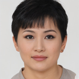 Joyful asian young-adult female with short  brown hair and brown eyes