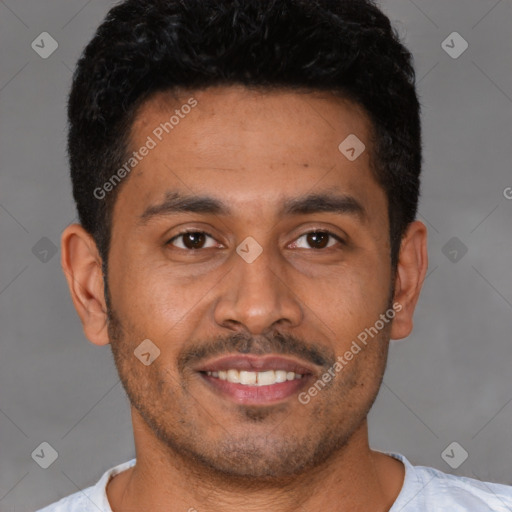 Joyful latino young-adult male with short  black hair and brown eyes