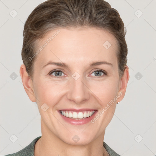 Joyful white young-adult female with short  brown hair and grey eyes