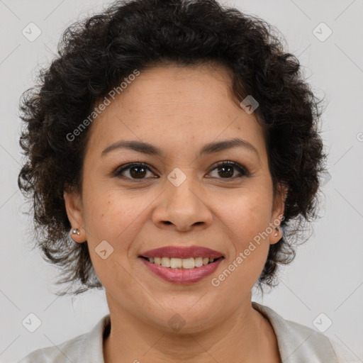 Joyful latino adult female with medium  brown hair and brown eyes