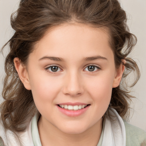 Joyful white child female with medium  brown hair and brown eyes