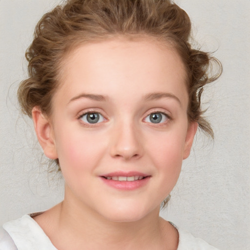 Joyful white child female with medium  brown hair and blue eyes