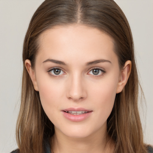 Neutral white young-adult female with long  brown hair and brown eyes