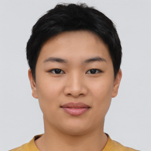 Joyful asian young-adult female with short  black hair and brown eyes