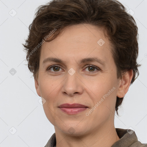 Joyful white adult female with short  brown hair and brown eyes