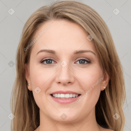 Joyful white young-adult female with long  brown hair and grey eyes