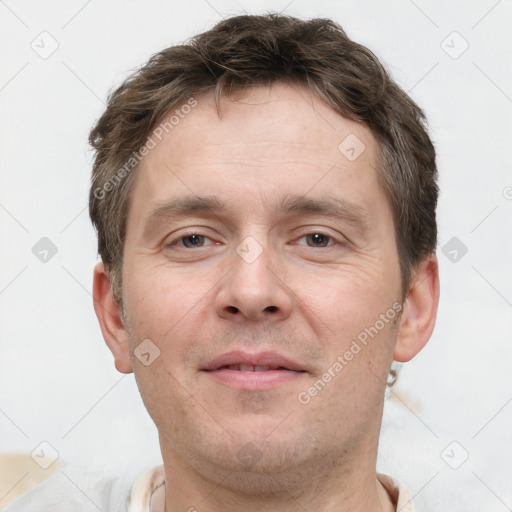 Joyful white adult male with short  brown hair and grey eyes