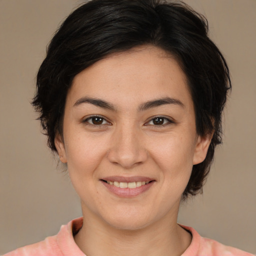 Joyful white young-adult female with medium  brown hair and brown eyes
