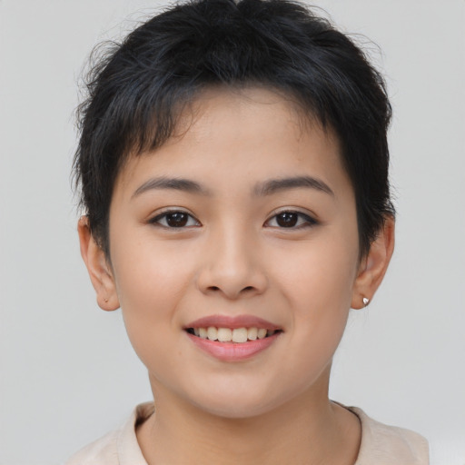 Joyful asian child female with short  brown hair and brown eyes