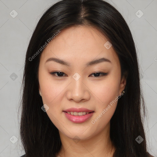 Joyful asian young-adult female with long  brown hair and brown eyes