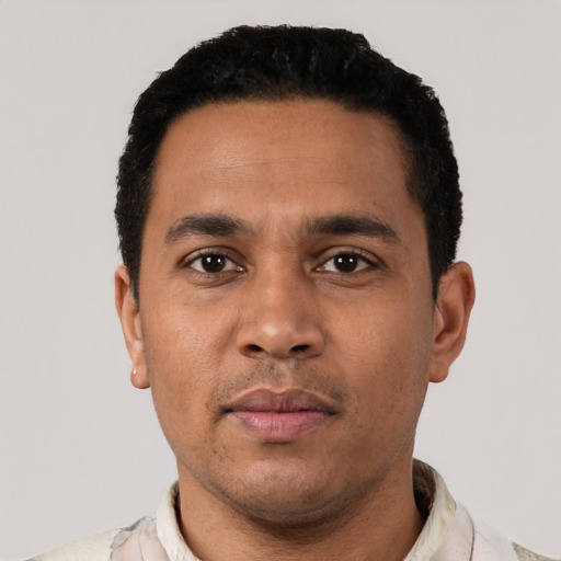 Neutral latino young-adult male with short  black hair and brown eyes