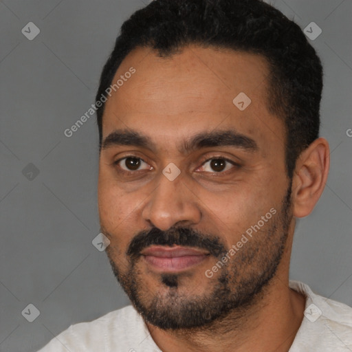 Joyful latino young-adult male with short  black hair and brown eyes