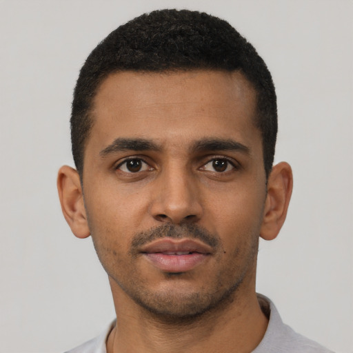 Neutral black young-adult male with short  black hair and brown eyes