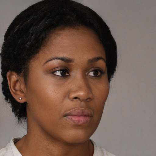 Neutral black young-adult female with short  black hair and brown eyes