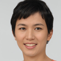 Joyful asian young-adult female with short  brown hair and brown eyes