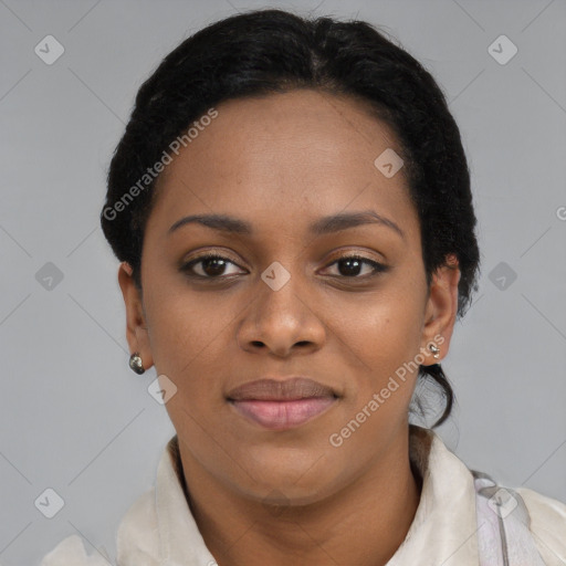Joyful black young-adult female with short  black hair and brown eyes
