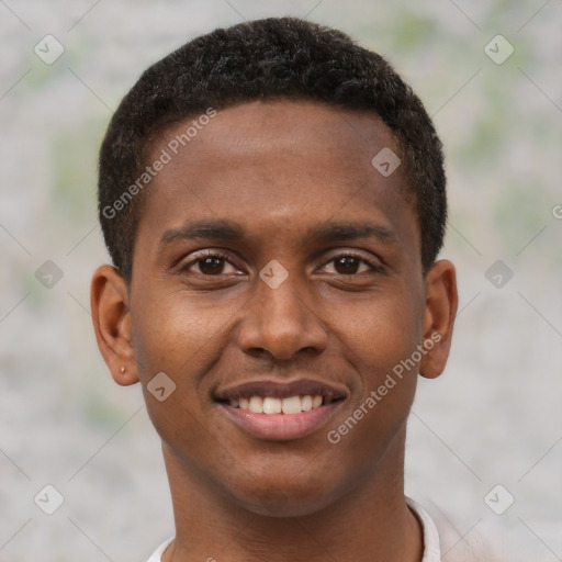 Joyful black young-adult male with short  brown hair and brown eyes