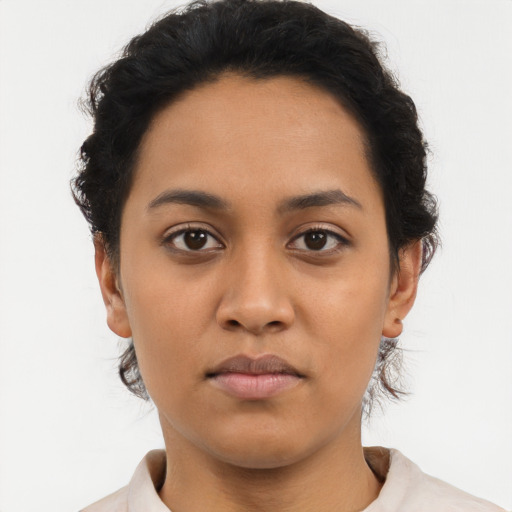 Neutral latino young-adult female with short  black hair and brown eyes