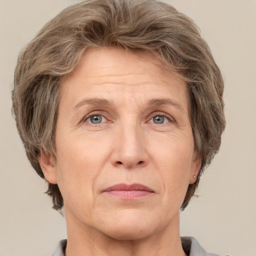 Joyful white middle-aged female with short  brown hair and grey eyes