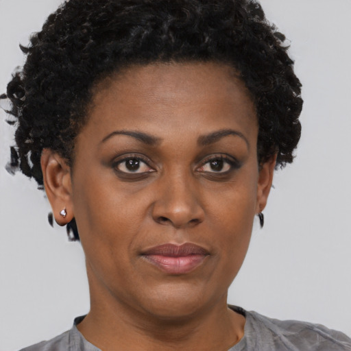 Neutral black young-adult female with short  brown hair and brown eyes