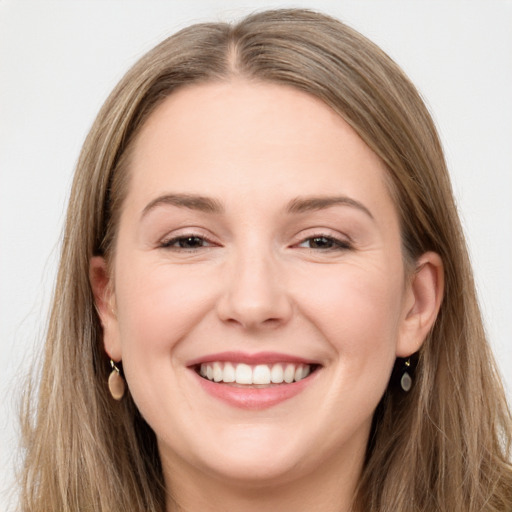 Joyful white young-adult female with long  brown hair and grey eyes