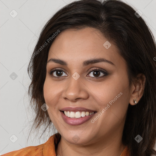 Joyful white young-adult female with long  brown hair and brown eyes