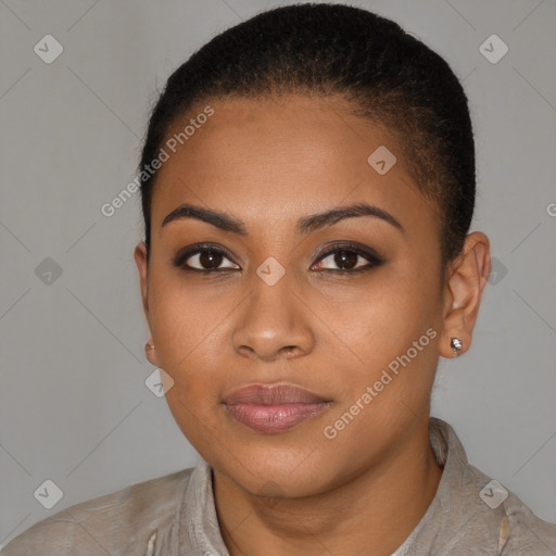 Joyful black young-adult female with short  brown hair and brown eyes