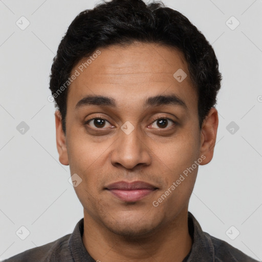 Joyful latino young-adult male with short  black hair and brown eyes