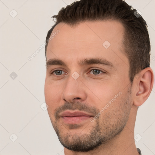 Joyful white young-adult male with short  brown hair and brown eyes