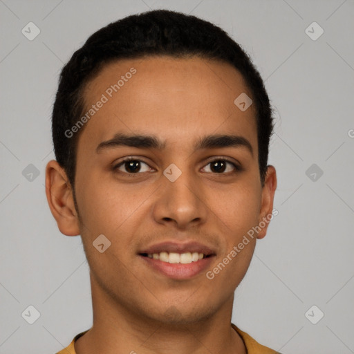 Joyful latino young-adult male with short  brown hair and brown eyes