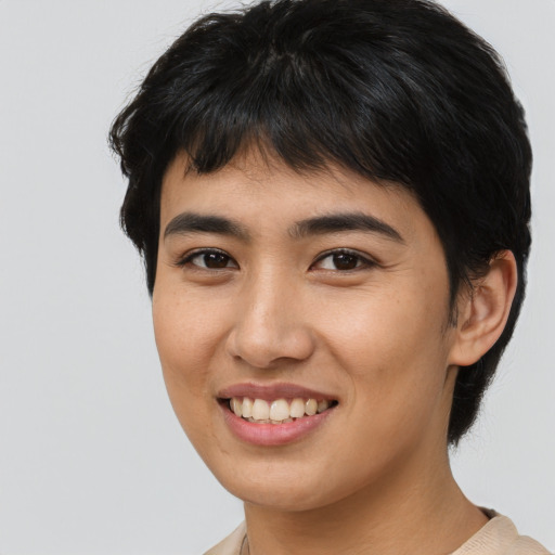Joyful asian young-adult female with medium  black hair and brown eyes
