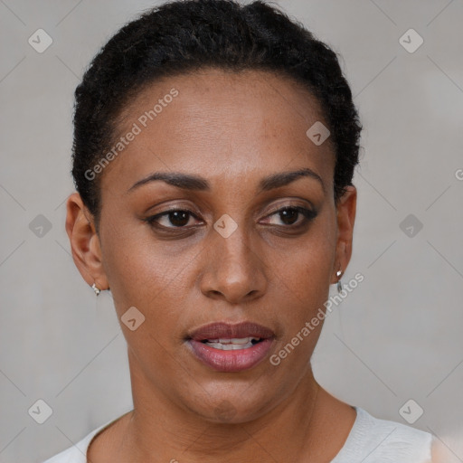 Joyful black young-adult female with short  brown hair and brown eyes