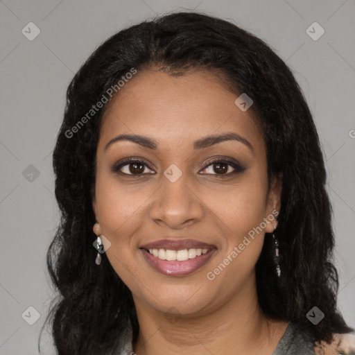 Joyful black young-adult female with long  brown hair and brown eyes