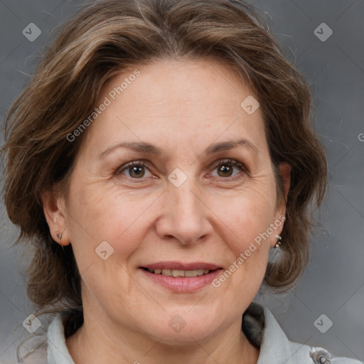 Joyful white adult female with medium  brown hair and brown eyes