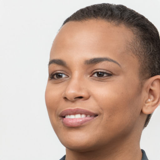 Joyful latino young-adult female with short  brown hair and brown eyes