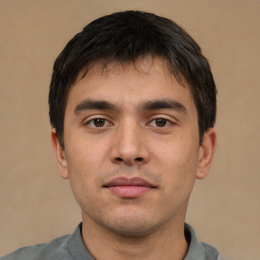 Neutral white young-adult male with short  black hair and brown eyes