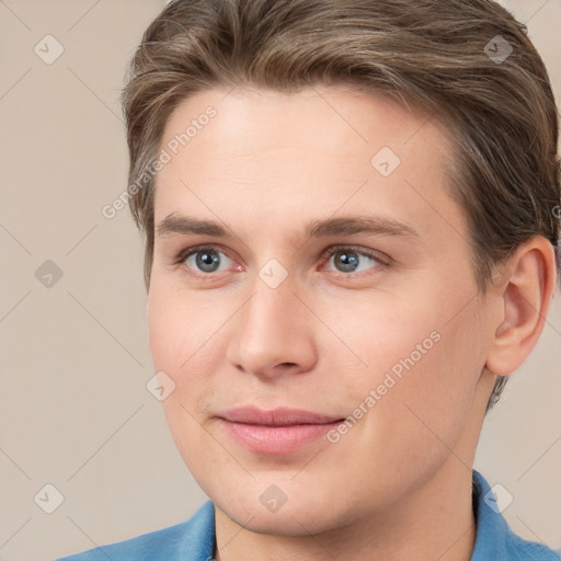 Joyful white young-adult female with short  brown hair and grey eyes