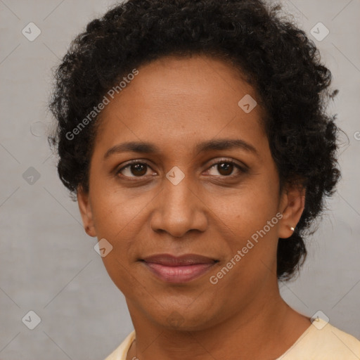 Joyful black adult female with short  brown hair and brown eyes