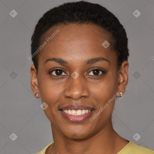 Joyful black young-adult female with short  black hair and brown eyes